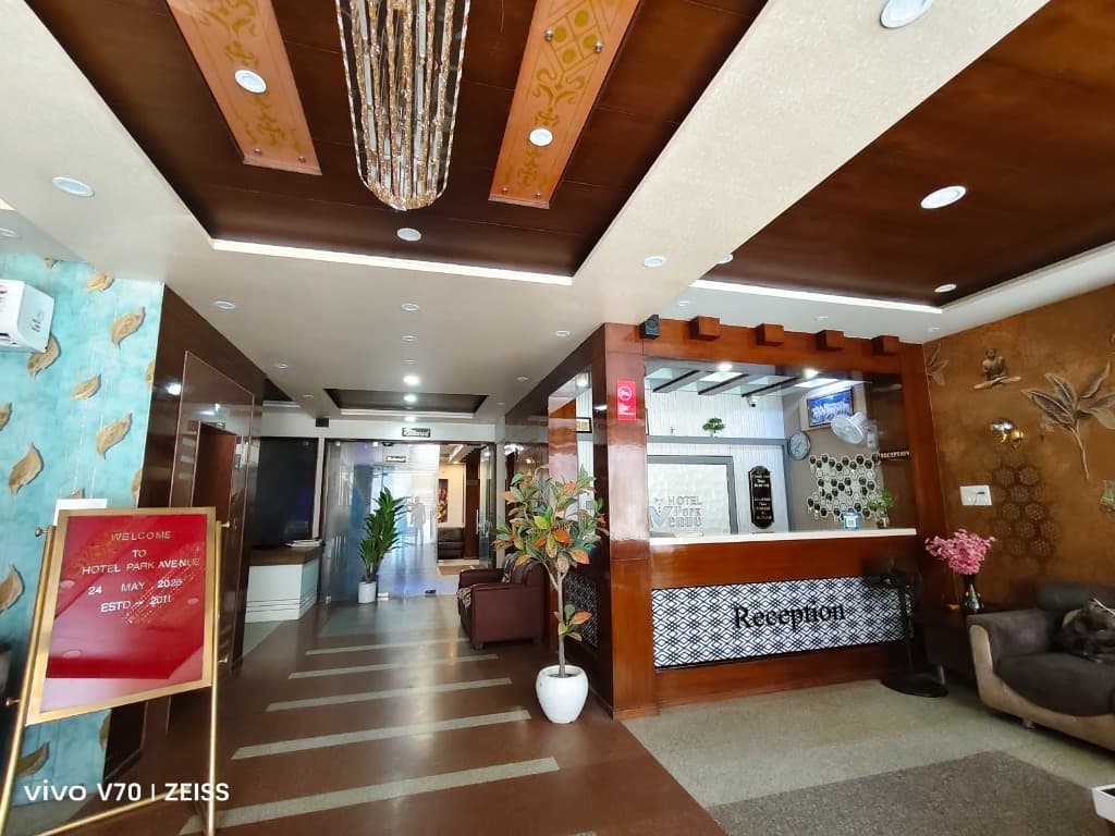 Warm elevator corridor and reception desk entrance lobby at Hotel Park Avenue Sikar